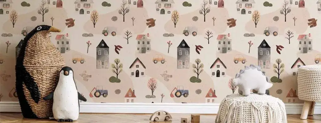 A children’s room with patterned Scandinavian-style wallpaper on the wall. The wallpaper has a light background and a repeating motif of a small town, featuring minimalist houses, trees, cars, tractors and birds in muted colours.